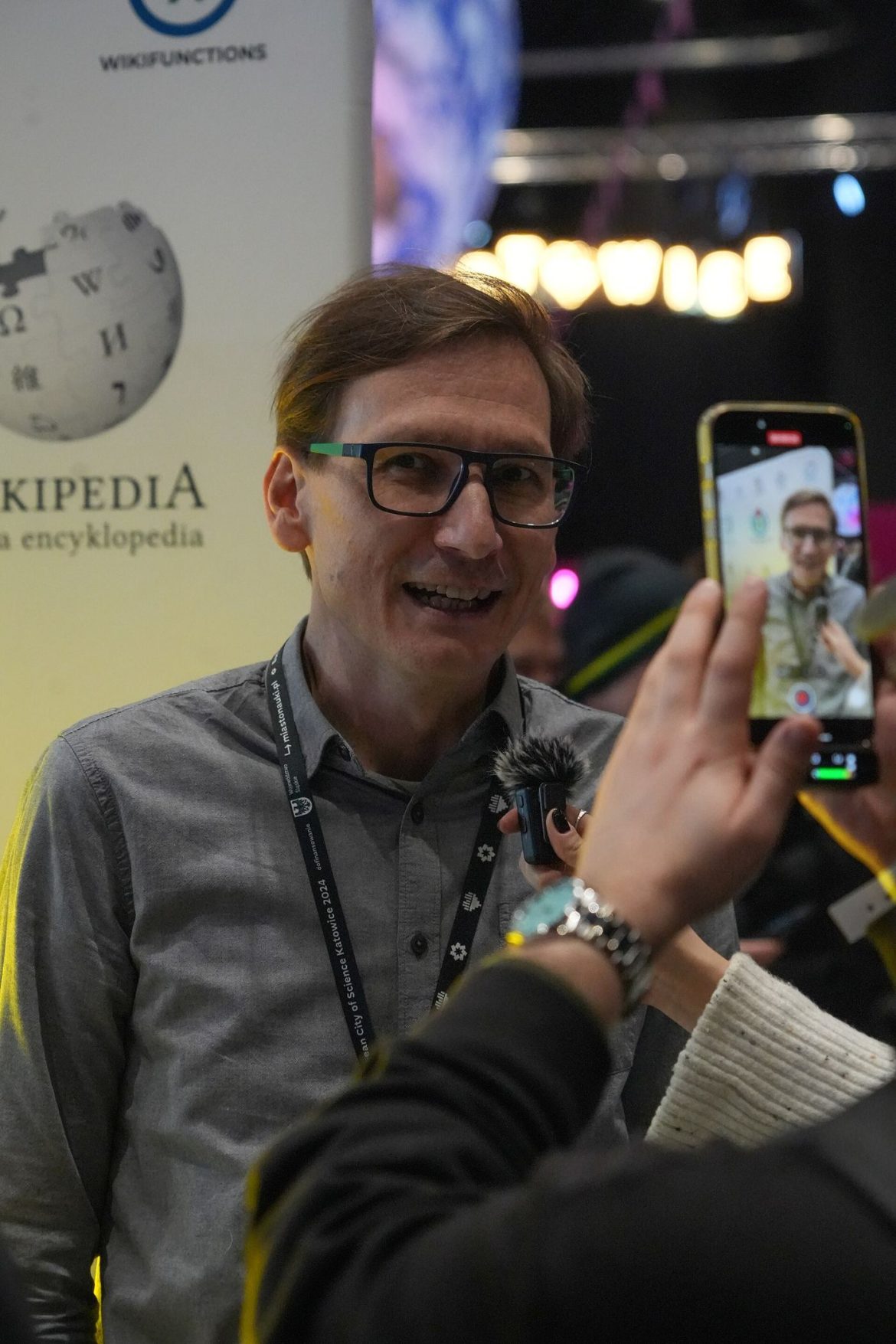 A citizen reporter filming an event on a smartphone